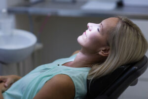 An image of a woman under sedation at a dental office.