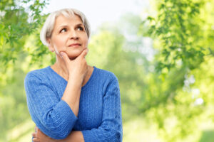 Woman thinking about oral health.