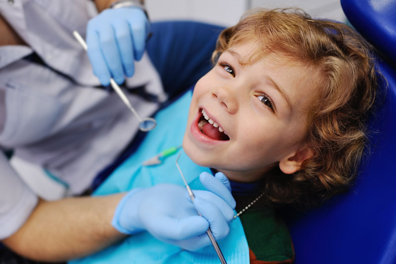 An image of a pediatric dental patient getting a tongue tie released.
