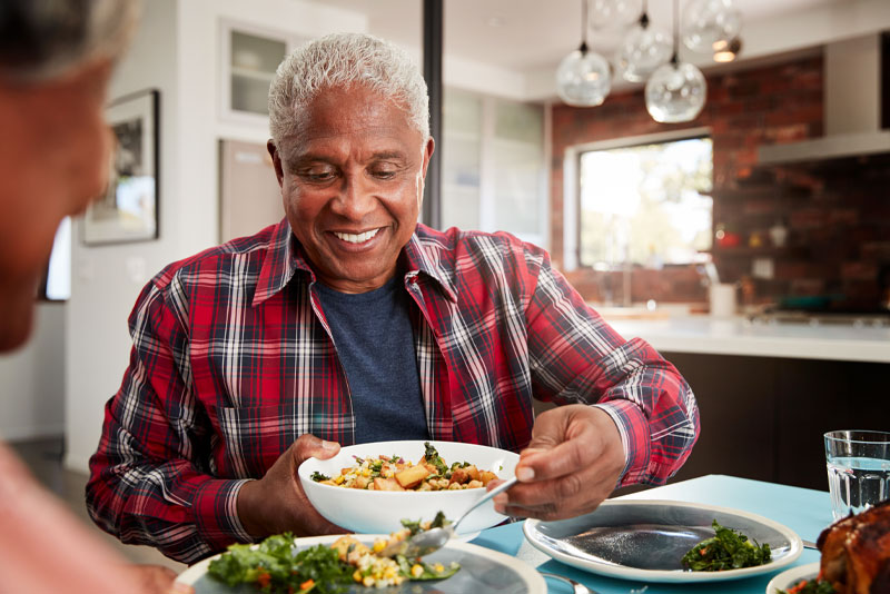 Dental Implant Patient Eating Happily After Dental Implant Procedure