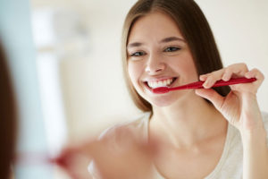 Dental Patient Brushing Their Full Arch Dental Implant