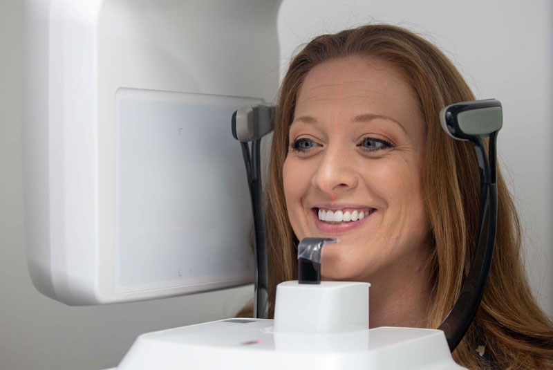 An image of a woman getting a cbct scan.