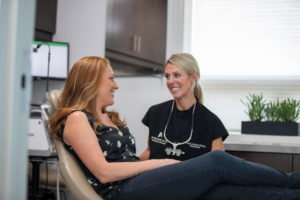 dr. lauren anderson with a crown lengthening dental patient.