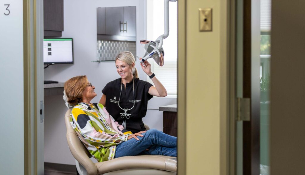 dr anderson with a patient at her practice before an examination