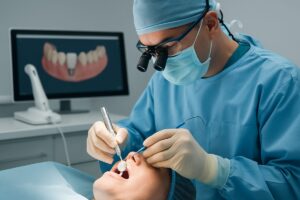 A dentist is performing a teeth operation on a patient, utilizing modern technology. The dentist is wearing surgical attire and using precise instruments, with a focus on ceramic dental implants. No text on image.