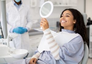 Patient consulting a periodontist in a modern dental office environment