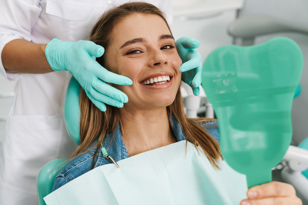 Dentist consulting a patient about gum graft procedure in a dental office